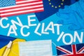 Top view of lettering cancellation near medical mask, latex gloves and flags of countries