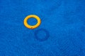 Top view of lifebuoy floating in blue swimming pool, soft focus Royalty Free Stock Photo