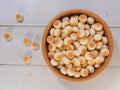 Top view of little ball cookies on wooden bowl on wooden background. Designed mouthpieces for children Royalty Free Stock Photo