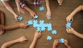 Top view of little children playing puzzle together Royalty Free Stock Photo
