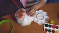 Top view on little girl who creating craft pumpking