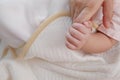 Top view of a little hand of baby  holding finger of a father hand with copy space Royalty Free Stock Photo
