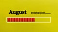 Top view of loading bar showing the end of August month with yellow paper background. Royalty Free Stock Photo