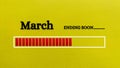 Top view of loading bar showing the end of March month with yellow paper background. Royalty Free Stock Photo