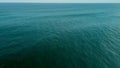 Top view of a lonely surfer in the middle of the ocean. Alone in the ocean. Royalty Free Stock Photo