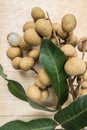 Top view longan fruits with wood background
