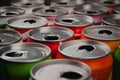 Top view of a lot of multi-color opened aluminium cans of beer or soda