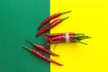 Top view, lots of red chili peppers on a yellow-green background