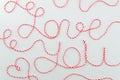 Top view Love You words with heart lettering make with rope on white background