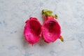 Top view of low calorie tropical Asian dragon fruit, cut in half with flesh already scooped out, leaving behind just the rind_