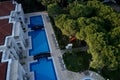 Top view of a luxury hotel resort with swimming pool and green garden. Royalty Free Stock Photo