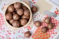 Top view macadamia on napery and wooden bowl Royalty Free Stock Photo