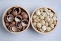 Top view macadamia nuts and shell in wooden bowl Royalty Free Stock Photo