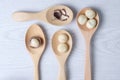 Top view macadamia nuts and shell in wooden spoons Royalty Free Stock Photo
