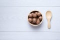 Top view macadamia in wooden bowl Royalty Free Stock Photo