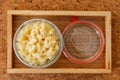 Top view of Macaroni Cheese Baked with meat sauce in glass bowl on wooden tray Royalty Free Stock Photo