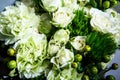 Top view macro on elegant bouquet of big white roses and fresh greenery Royalty Free Stock Photo