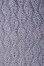 Top view macro handmade openwork binding gray, knitted, woolen scarf with pattern