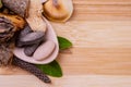 Top view macro shot of herbal pills and tablets arranged with spices on a red stone. Unani medicines concept Royalty Free Stock Photo