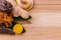 Top view macro shot of herbal pills and tablets arranged with spices on a red stone. Unani medicines concept Royalty Free Stock Photo