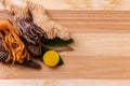 Top view macro shot of herbal pills and tablets arranged with spices on a red stone. Unani medicines concept Royalty Free Stock Photo