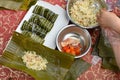 madam making traditional Chinese ZongZi for Dragon Boat Festival ie DuanWu festival