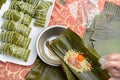 madam making traditional Chinese ZongZi for Dragon Boat Festival ie DuanWu festival