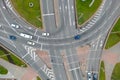 Top view of a major road junction in the city during the day. A large busy roundabout. Urban traffic and infrastructure. Green Royalty Free Stock Photo