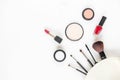 Top View. Makeup cosmetics tools and beauty cosmetics, products and facial cosmetics package lipstick, eyeshadow on the white bac