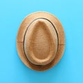 Top view of male fedora hat over blue background Royalty Free Stock Photo