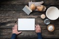 Top view of male hands about to write a recipe for a homemade healthy sourdough bread Royalty Free Stock Photo