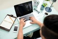 Top view, male hands typing on a laptop