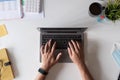 Top view of male hands working on modern laptop calculator financial report and medical face mask on white background Royalty Free Stock Photo