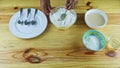 Top view on man hands making deepening by spoon in white flour served in bowl