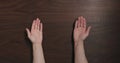 Top view man hands offer gesture black walnut table with copy space Royalty Free Stock Photo