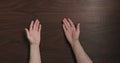 Top view man hands offer gesture black walnut table with copy space