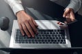 Top view of man hands typing on laptop and smartphone ,  surfing the internet or online working . business and technology Royalty Free Stock Photo