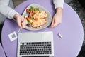 Man having appetite dinner while sitting at the cafe