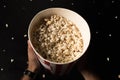 top view of man holding bucket of popcorn Royalty Free Stock Photo