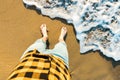 Top view of man legs and sea wave on the beach dreaming of vacation and recreation. hope concept Royalty Free Stock Photo