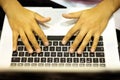 Top view man`s hands typing on laptop computer. Royalty Free Stock Photo