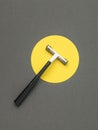 Top view of a man\'s razor in a yellow circle on a gray background