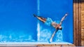 Top view of man lying in water in swimming pool outdoors. Royalty Free Stock Photo