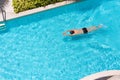 Top view of a man in the swimming pool. Royalty Free Stock Photo