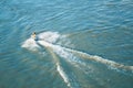 A top view of a man turning riding having fun on jet ski wit a l Royalty Free Stock Photo