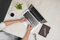 Top view of man using a modern portable computer in home office Royalty Free Stock Photo