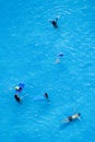 Top view of man, woman and children are relaxing and enjoy activities in the swimming pool of the luxury hotel and resort at Royalty Free Stock Photo