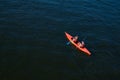 Top view of a man and a woman in a kayak floating on the river. Sports recreation on the water. Physical education