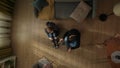 Top view of a man and a woman sitting on the living room floor near the couch. Shocked man holds up positive pregnancy Royalty Free Stock Photo