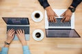 Top view of man and woman working with two laptops Royalty Free Stock Photo